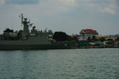 Scenic view of sea against buildings in city