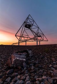 Silhouette of rocks against sky during sunset