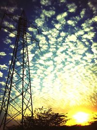 Low angle view of silhouette trees against sky at sunset