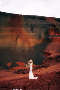 Woman standing on rock