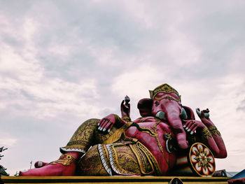 Low angle view of statue against sky