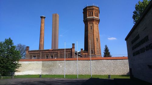 Low angle view of prison against blue sky