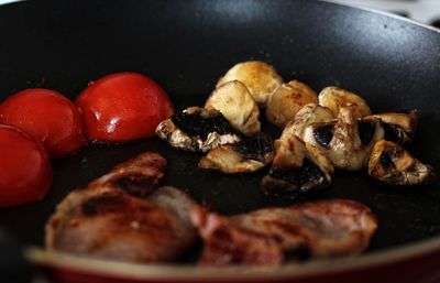 Close-up of meat in cooking pan