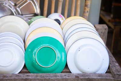 High angle view of plates in container at home