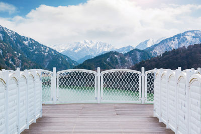 Scenic view of mountains against cloudy sky