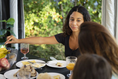 Teenage girl having meal at camping