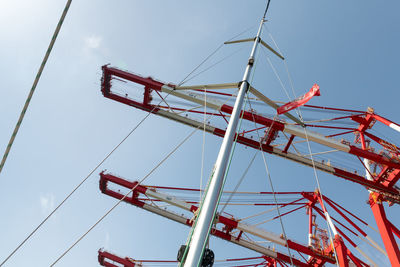 Low angle view of ferris wheel against sky