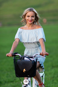 Portrait of smiling young woman standing outdoors