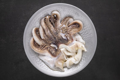 High angle view of mushrooms in plate on table