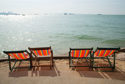 Lounge chairs and tables at beach