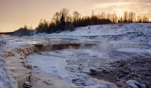 Scenic view of landscape against sky during winter