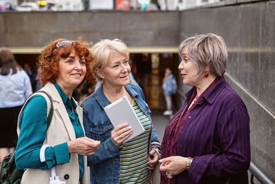 Women standing on smart phone