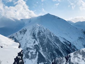 Scenic view of snowcapped mountains against sky