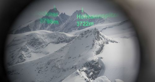 Scenic view of mountains against sky during winter