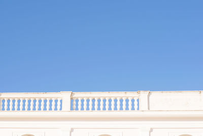 Low angle view of building against clear blue sky