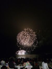 Firework display at night