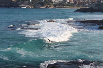 People surfing in sea
