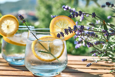 Cool lavender homemade lemonade with lemon slices and lavender flower. detox summer drink.