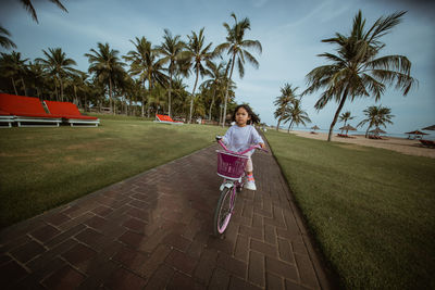 Rear view of woman walking on street