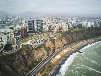 Aerial view of cityscape against sky