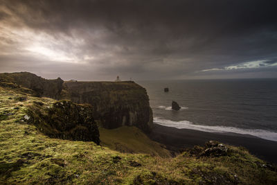 Scenic view of sea against cloudy sky