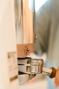 Close-up of hand holding coffee cup