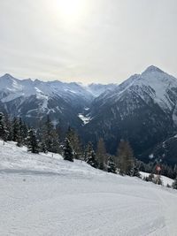 Scenic view of snowcapped mountains against sky during winter