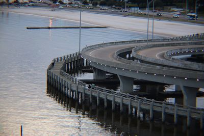 High angle view of swimming pool by river in city