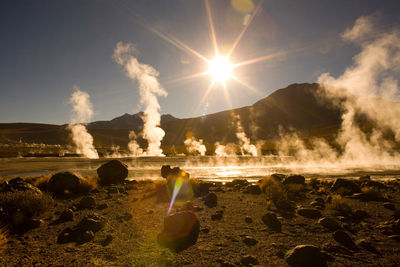 Sunrise behind fumaroles, el tatio geysers, atacama desert, antofagasta region, chile, south america