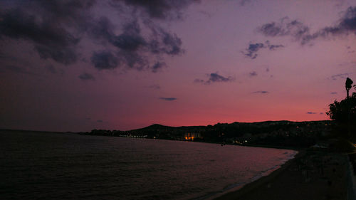 Scenic view of sea against sky at dusk