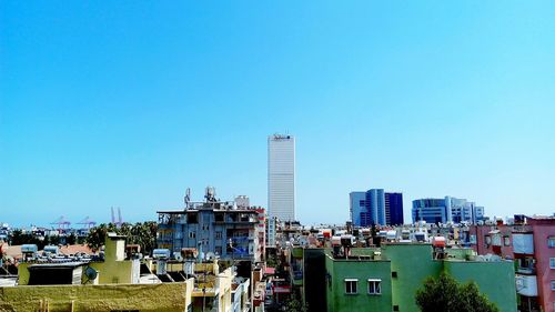 Construction site against clear blue sky