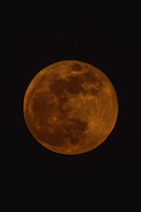 Low angle view of moon against sky at night