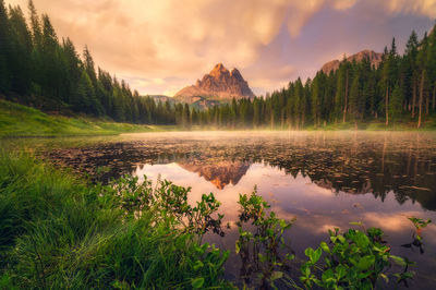 Scenic view of lake against sky during sunset