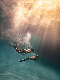 Woman swimming in sea