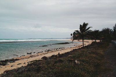 Scenic view of sea against cloudy sky