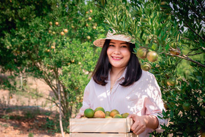 Portrait of a smiling young woman in park