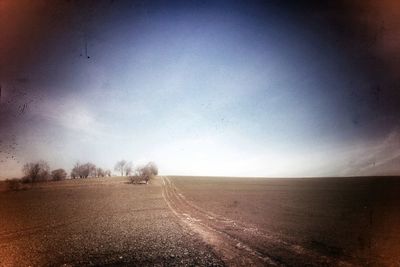 Road passing through field