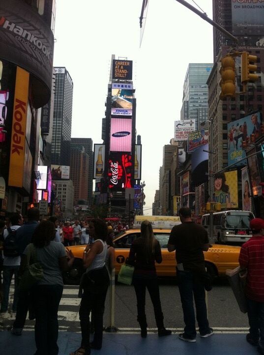 PEOPLE WALKING ON STREET IN CITY