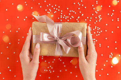 Midsection of woman holding gift