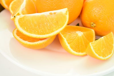 Close-up of orange fruits in plate