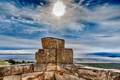 Castle by sea against sky