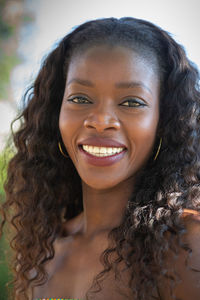 Close-up portrait of a smiling young woman