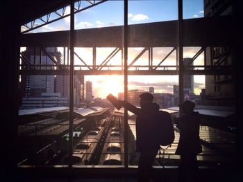 Silhouette of woman at sunset