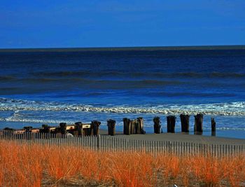 Scenic view of calm sea against clear sky