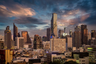 Modern buildings in city against sky