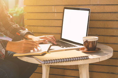 Man using laptop on table