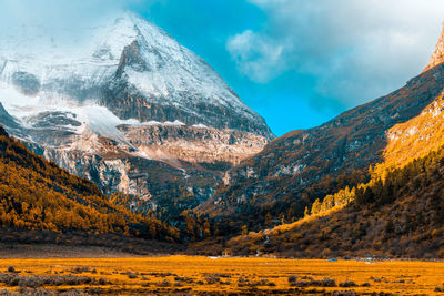 Scenic view of snowcapped mountains against sky