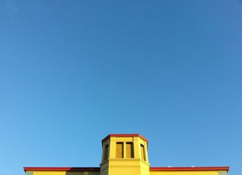 Low angle view of built structure against blue sky