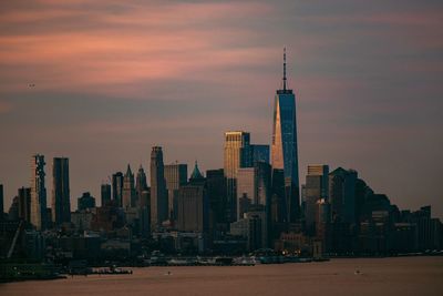 Modern buildings in city at sunset