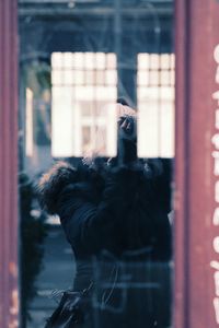 Reflection of camera on glass window